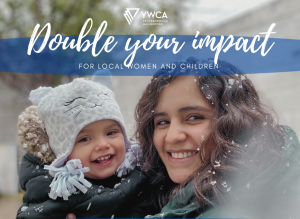 a young, smiling mother with snowflakes in her hair holds her child in her arms beneath the YWCA logo and the words "double your impact for local women and children"