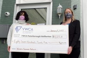 Christine Teixeira (right), president of the Women's Business Network of Peterborough, presents a cheque for $8,725.31 to Ria Nicholson, lead philanthropic advisor with YWCA Peterborough Haliburton. The funds, raised in December 2021 during the networking organization's annual holiday gala, will support the YWCA Crossroads Shelter for women and children fleeing violence and abuse.